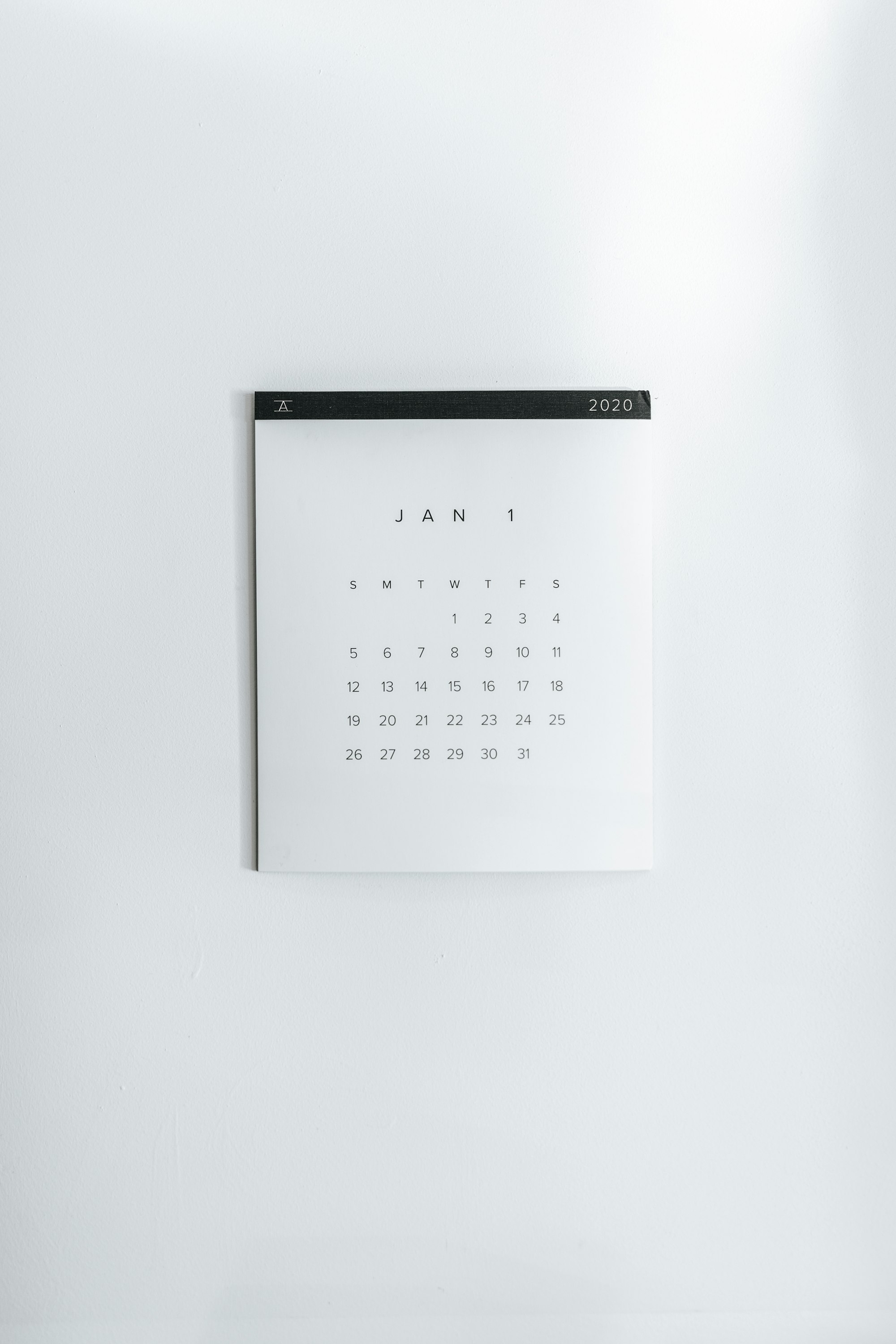 A wall calendar showing a January monthly grid
