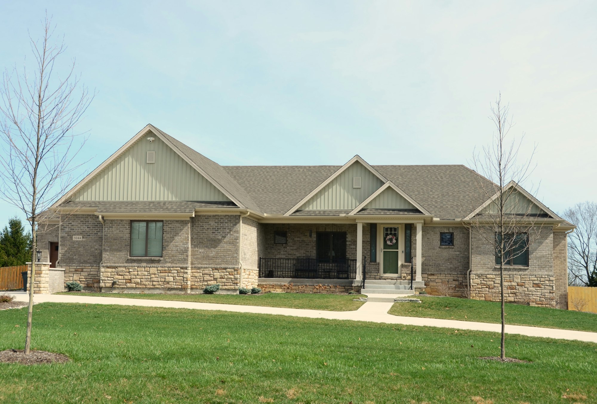 Exterior of a single-story brick home with a covered front porch